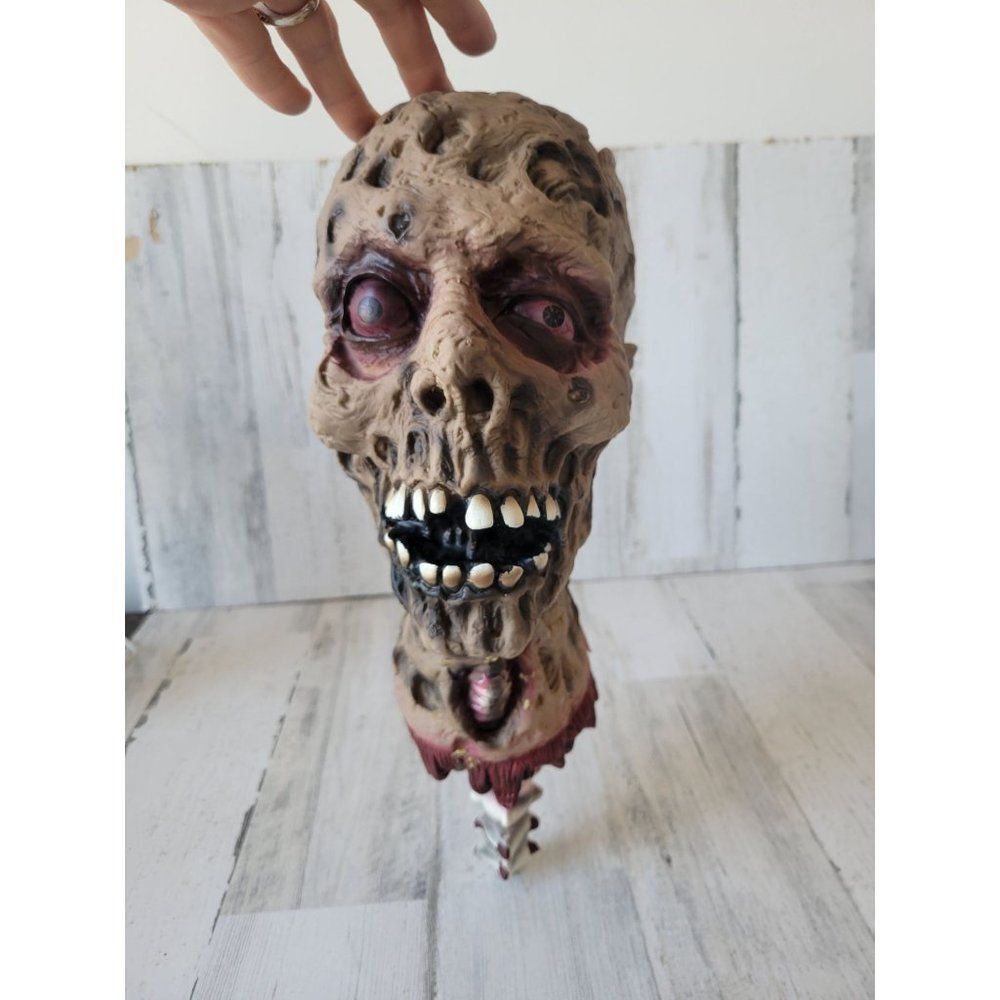 Beheaded zombie head Halloween prop scary skull